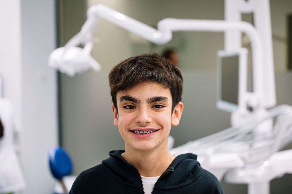 A Child with Braces Smiling at Spearmint Kids Dental and Orthodontics, Wichita Falls, TX